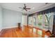 Spacious bedroom featuring hardwood floors, large windows, and a ceiling fan at 707 Royall Ave, Mount Pleasant, SC 29464