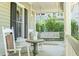 Relaxing front porch featuring rocking chairs and a swing perfect for enjoying the outdoors at 707 Royall Ave, Mount Pleasant, SC 29464
