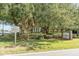 Image of Mount Pleasant Academy grounds, including signs, mature trees, and landscaping at 707 Royall Ave, Mount Pleasant, SC 29464