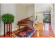 Entryway featuring hardwood floors, an ornate rug, and a vintage piano at 707 Royall Ave, Mount Pleasant, SC 29464