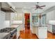 Well-equipped kitchen featuring stainless steel appliances, white cabinets, and a center island at 707 Royall Ave, Mount Pleasant, SC 29464