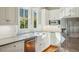 Bright kitchen features stainless steel appliances, subway tile backsplash, and a farmhouse sink at 707 Royall Ave, Mount Pleasant, SC 29464