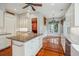 Spacious kitchen features an island with granite countertop, hardwood floors, and modern appliances at 707 Royall Ave, Mount Pleasant, SC 29464