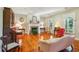 Elegant living room with gleaming hardwood floors, a fireplace, and abundant natural light at 707 Royall Ave, Mount Pleasant, SC 29464