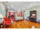 Spacious living room with hardwood floors, a fireplace, and open access to other rooms at 707 Royall Ave, Mount Pleasant, SC 29464