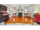 Inviting living room with a classic fireplace, vintage furnishings, and polished hardwood floors at 707 Royall Ave, Mount Pleasant, SC 29464
