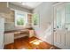 Bright home office featuring custom built-ins and hardwood floors, perfect for working from home at 707 Royall Ave, Mount Pleasant, SC 29464