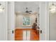 Home office featuring hardwood floors, built-in shelving, and a large window at 707 Royall Ave, Mount Pleasant, SC 29464