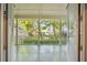 Covered porch offers serene views of the landscaped backyard and surrounding trees at 707 Royall Ave, Mount Pleasant, SC 29464