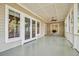 Inviting porch with multiple entrances, ceiling fan, and views of the surroundings at 707 Royall Ave, Mount Pleasant, SC 29464