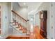 Hardwood staircase with carpet runner and white railing leads to the upper level at 707 Royall Ave, Mount Pleasant, SC 29464