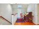 Upstairs landing features hardwood floors and a charming antique desk area at 707 Royall Ave, Mount Pleasant, SC 29464
