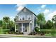 Charming two-story home featuring lap siding, a covered porch, and a neatly landscaped front yard at 814 Gentle Breeze Dr, Summerville, SC 29486