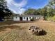 Spacious backyard featuring a brick patio and brick fire pit, great for outdoor activities at 922 Dill Ave, Charleston, SC 29412