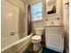 Cozy bathroom featuring a shower-tub combo and white vanity sink with a window at 922 Dill Ave, Charleston, SC 29412
