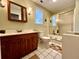 Bathroom with a wooden vanity and shower with glass door at 922 Dill Ave, Charleston, SC 29412
