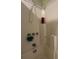 Shower with white tile surround and a showerhead with temperature controls at 922 Dill Ave, Charleston, SC 29412