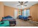 Bedroom with two beds, ceiling fan, and ample natural light at 9759 Seed St, Ladson, SC 29456