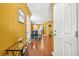 Inviting foyer with hardwood floors and an open view to the dining area and kitchen at 9759 Seed St, Ladson, SC 29456