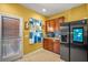 Cozy kitchen with stainless steel appliances, wooden cabinets and tiled flooring at 9759 Seed St, Ladson, SC 29456
