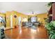Spacious living room featuring hardwood floors, neutral colors and large windows at 9759 Seed St, Ladson, SC 29456