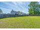 Large, grassy backyard enclosed by a wooden fence, perfect for , pets, or gardening at 101 Old Tree Rd, Goose Creek, SC 29445