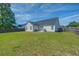 Well-maintained backyard with privacy fence, featuring a patio and sliding glass doors for indoor-outdoor living at 101 Old Tree Rd, Goose Creek, SC 29445