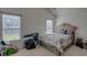 Bright bedroom featuring large windows for natural light and neutral carpeting at 101 Old Tree Rd, Goose Creek, SC 29445