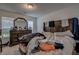 Bedroom featuring ample natural light from large windows, with dark wood dresser and matching headboard at 101 Old Tree Rd, Goose Creek, SC 29445