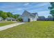 Shows the home's side yard, driveway, and a one car attached garage at 101 Old Tree Rd, Goose Creek, SC 29445