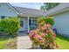 Charming front porch is adorned with a beautiful rose bush at 101 Old Tree Rd, Goose Creek, SC 29445