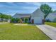 Charming single-story home featuring a well-manicured lawn and an attached one-car garage at 101 Old Tree Rd, Goose Creek, SC 29445