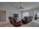 Comfortable living room with ceiling fan, neutral carpet and large windows at 101 Old Tree Rd, Goose Creek, SC 29445