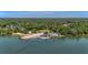 Beautiful aerial view of a waterfront property highlighting its prime location, dock and mature trees at 1010 Black Oak Rd, Bonneau, SC 29431