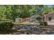 Large backyard with shed, metal carport, and lush green lawn at 1010 Black Oak Rd, Bonneau, SC 29431
