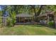 Secluded backyard featuring gazebo and shed with mature trees at 1010 Black Oak Rd, Bonneau, SC 29431