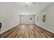 Spacious room featuring light walls, wood-look floors, ceiling fans, and bright windows at 1010 Black Oak Rd, Bonneau, SC 29431