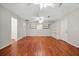 Spacious bonus room with wood floors, ceiling fans, built-in shelving, and ample natural light at 1010 Black Oak Rd, Bonneau, SC 29431