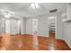 Huge bonus room with wood floors, three doors, built-in shelving, and ceiling fans at 1010 Black Oak Rd, Bonneau, SC 29431