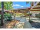 Large metal carport for parking and storage with beautiful lush foliage at 1010 Black Oak Rd, Bonneau, SC 29431