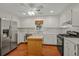Functional kitchen with stainless steel appliances, white cabinetry, and a center island, providing ample workspace at 1010 Black Oak Rd, Bonneau, SC 29431