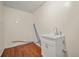Small laundry room with wood floors, sink and cabinet at 1010 Black Oak Rd, Bonneau, SC 29431