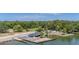 Scenic view of the building with a dock and water access, surrounded by mature trees and landscaping at 1010 Black Oak Rd, Bonneau, SC 29431