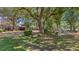 Expansive yard with mature trees, shrubs, and lush green grass, perfect for outdoor activities at 1010 Black Oak Rd, Bonneau, SC 29431