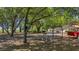 Wide angle of a well-shaded yard with lake view in the background at 1010 Black Oak Rd, Bonneau, SC 29431