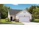 Charming one-story home featuring a welcoming front porch and a convenient two-car garage at 1021 Sagegrass Street, Summerville, SC 29485