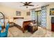 Bedroom with neutral walls, wood floors, a patterned rug, a ceiling fan, and a sliding glass door at 1116 Daffodil Ln, Mount Pleasant, SC 29464