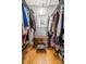 Walk-in closet with clothing racks, hardwood floors, a wooden chest, and a view of another room at 1116 Daffodil Ln, Mount Pleasant, SC 29464