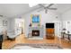 Bright living room features a fireplace, vaulted ceilings, and hardwood floors at 1116 Daffodil Ln, Mount Pleasant, SC 29464