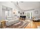 Spacious living room boasts an elegant wet bar, vaulted ceilings, and hardwood floors at 1116 Daffodil Ln, Mount Pleasant, SC 29464